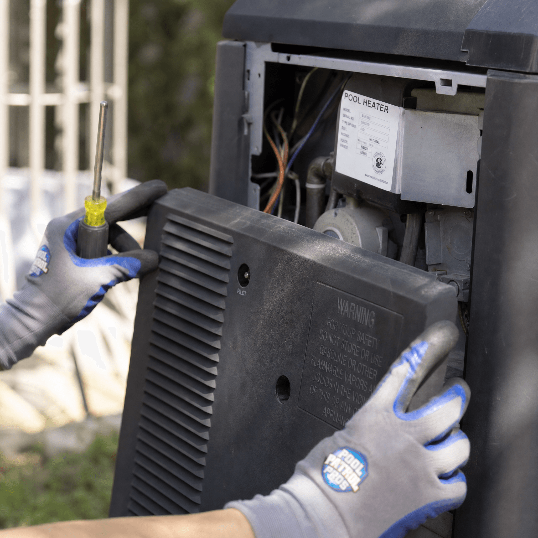 Pool heater being serviced by a Pool Patrol Pros technician
