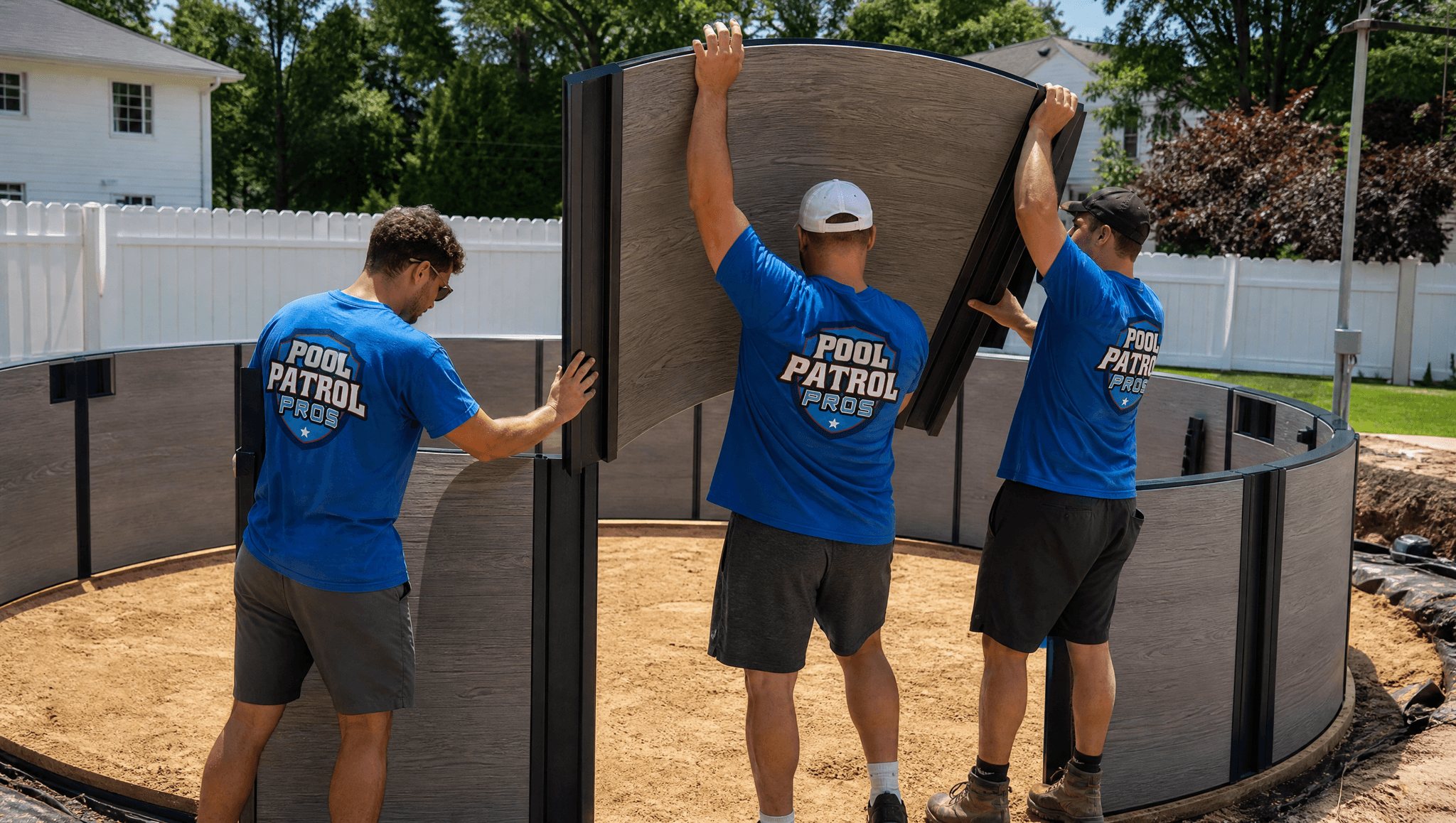 Pool Patrol Pros crew installing an above-ground pool wall and liner